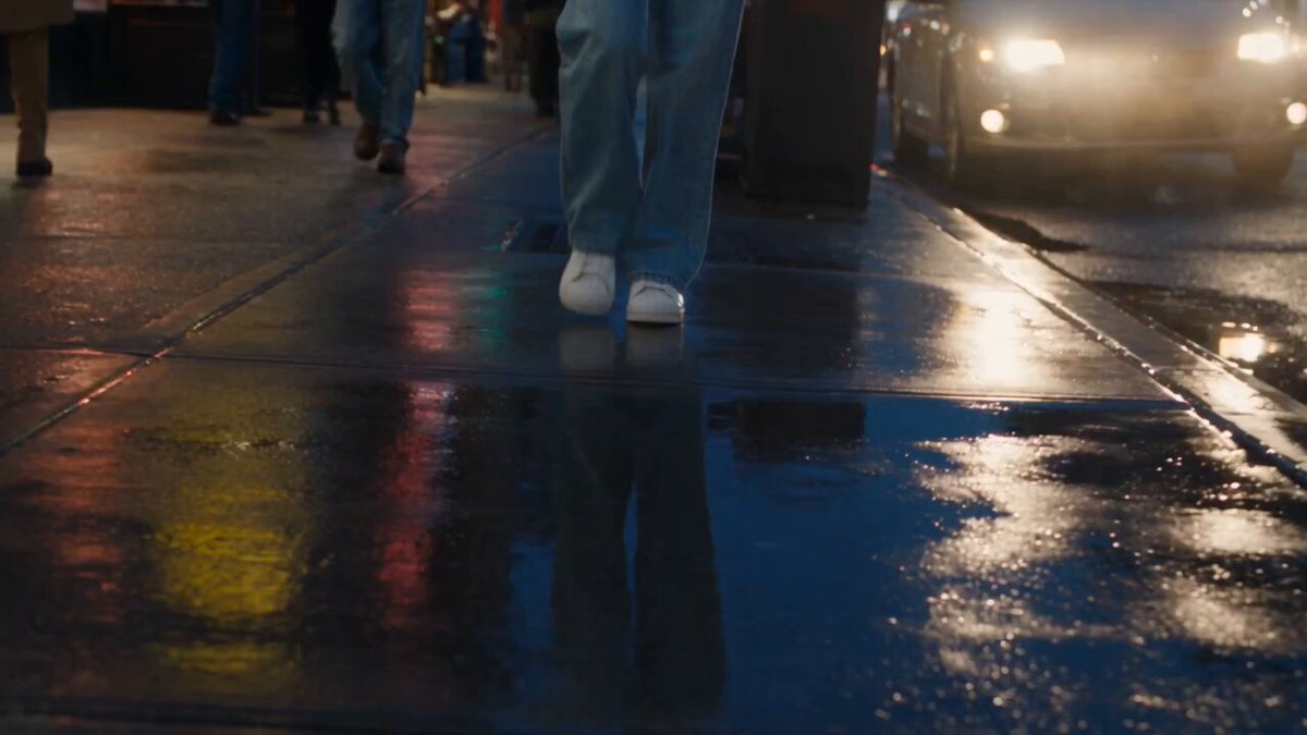 A Flip Phone and Drink Fly Through Rain